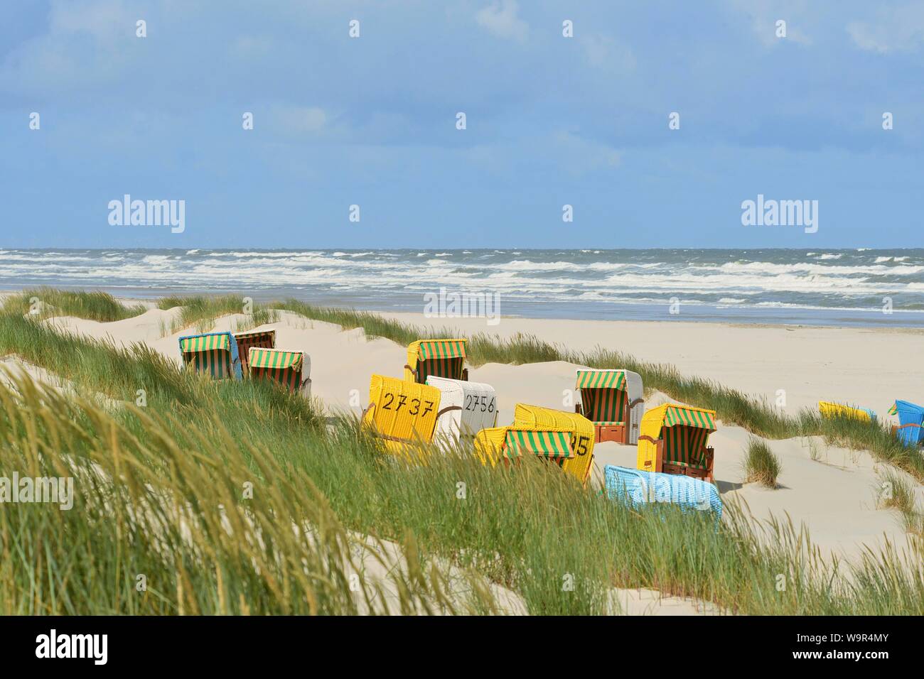 Sandy beach beach, bathing beach with beach chairs in the dunes, Juist, East Frisian Island, East Frisia, Lower Saxony, Germany Stock Photo