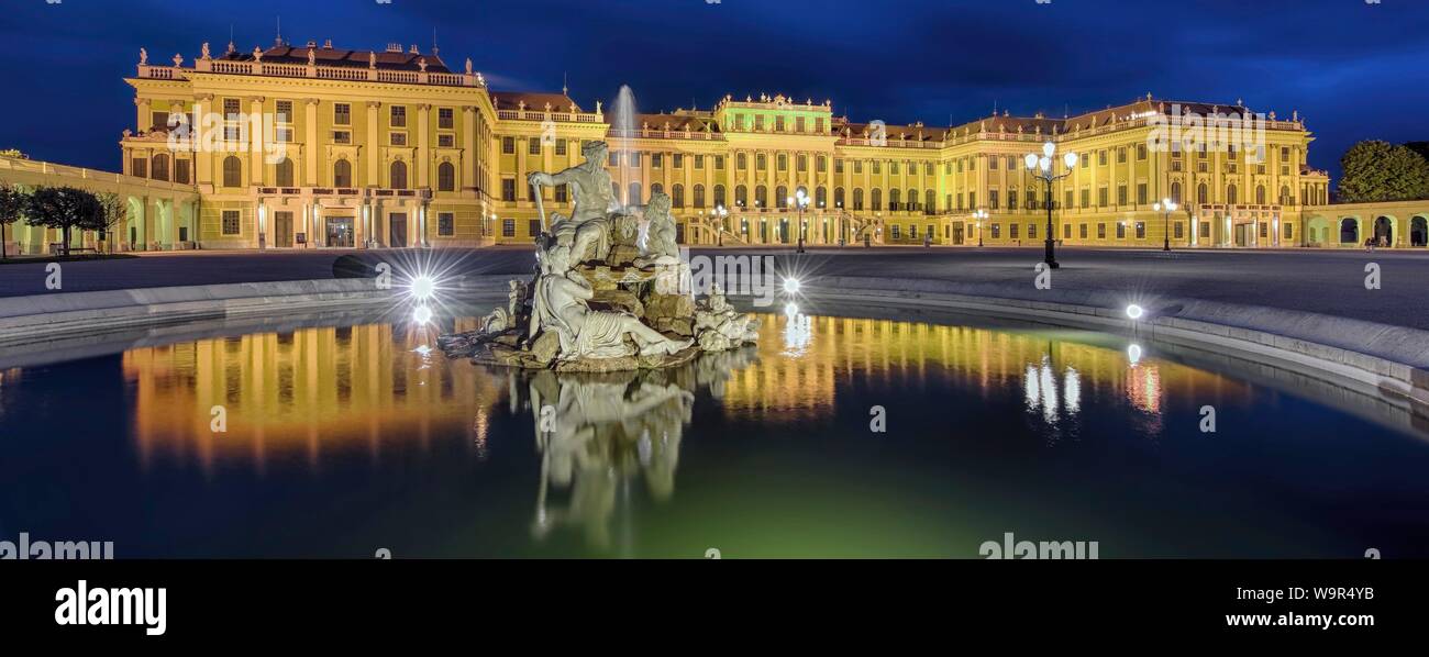 Evening atmosphere, Schonbrunn Palace with reflection in the fountain, Vienna, Austria Stock Photo