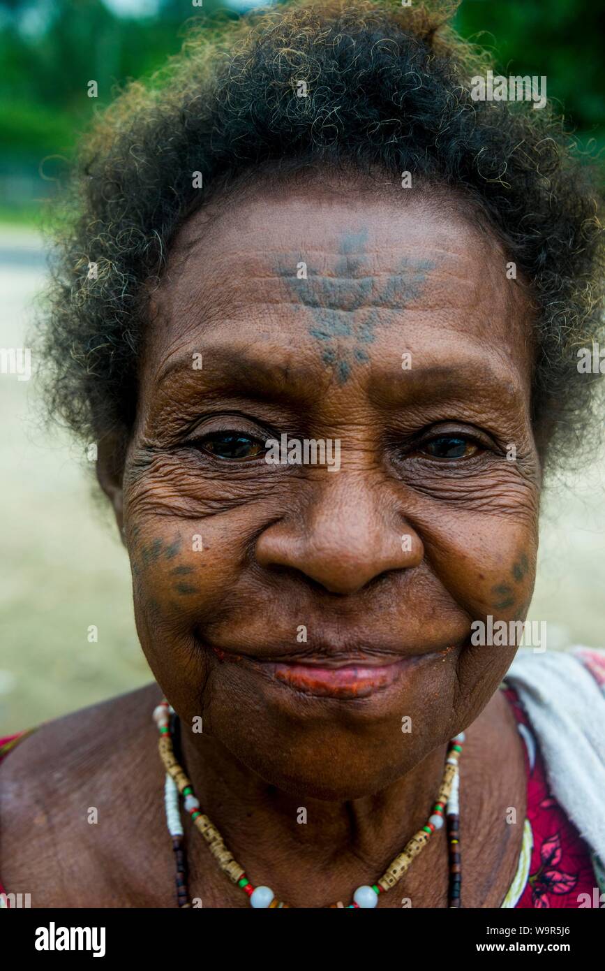 Old woman with tattoos in her face, Manus Island, Admirality islands, Papua New Guinea Stock Photo