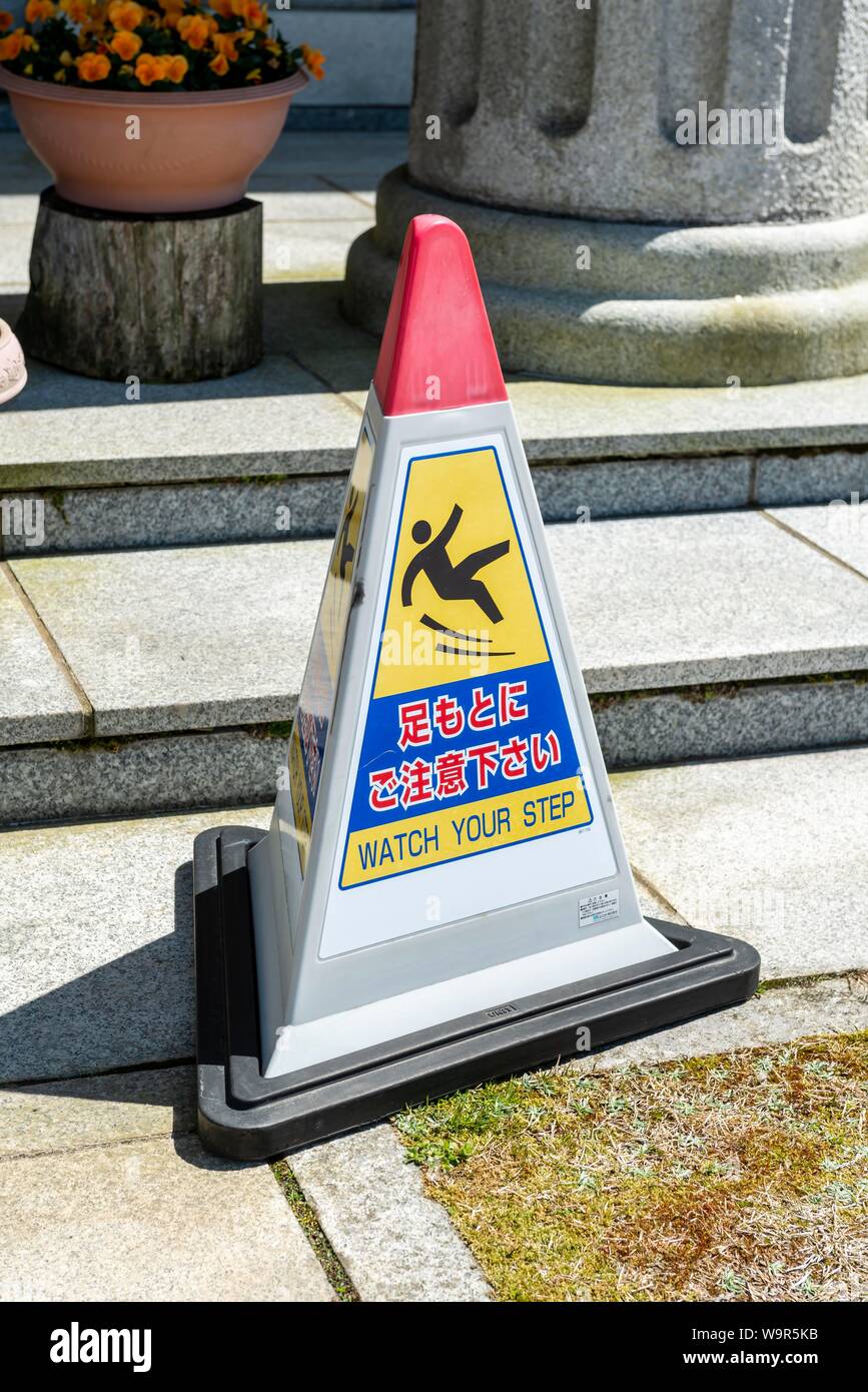 Danger of slipping, Beware Watch your Step, Warning on a pylon in Japanese, Japan Stock Photo