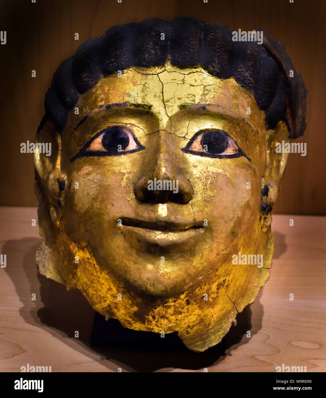 Woman's mask 1st century AD  Aueris (Hawara, Egypt) Painted and gilded stucco ,mask of mummies, Egypt, Egyptian. Stock Photo