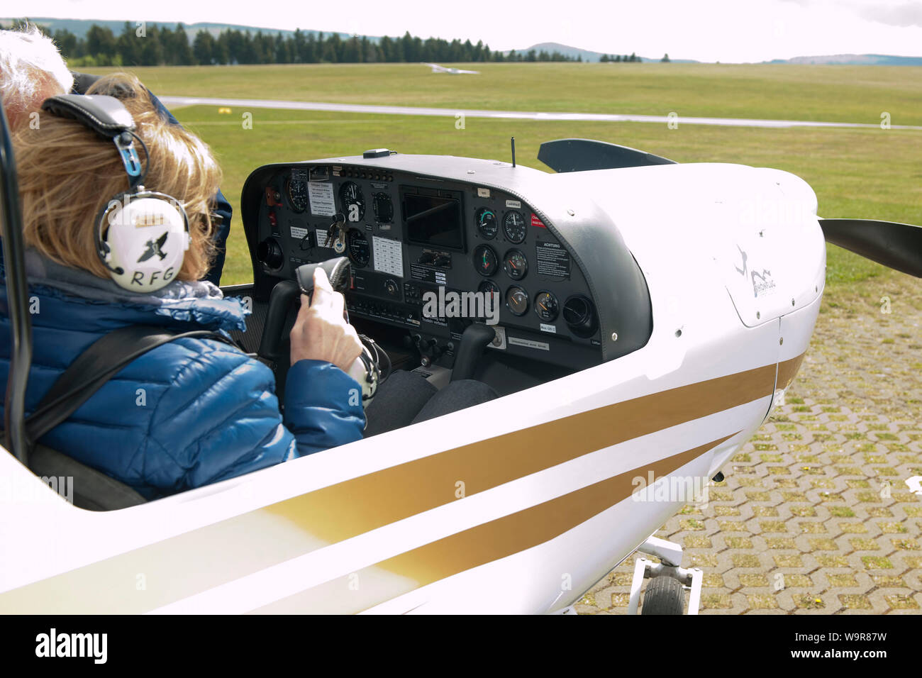 HK36 TC114 Diamond Airplane Super Dimona, Rotax engine, preflight-check, co-pilot, Wasserkuppe airfield, Gersfeld, Fulda, Rhoen, Hesse, Germany Stock Photo