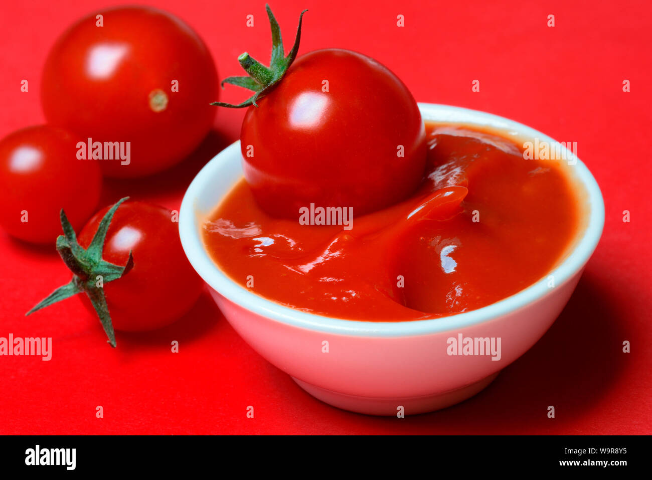 tomato ketchup and tomatoes Stock Photo