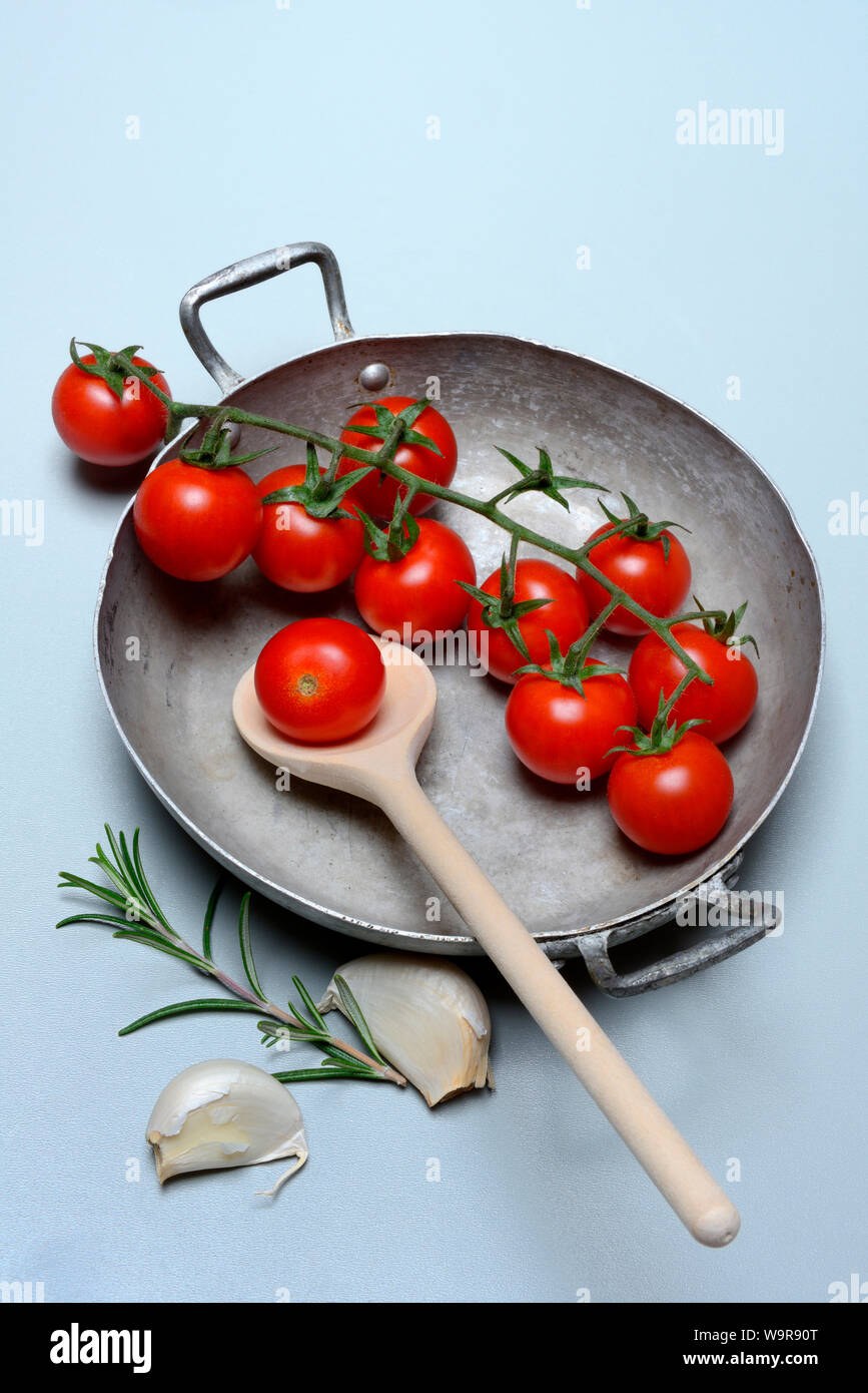 cherry tomatoes with rosemary and garlic Stock Photo