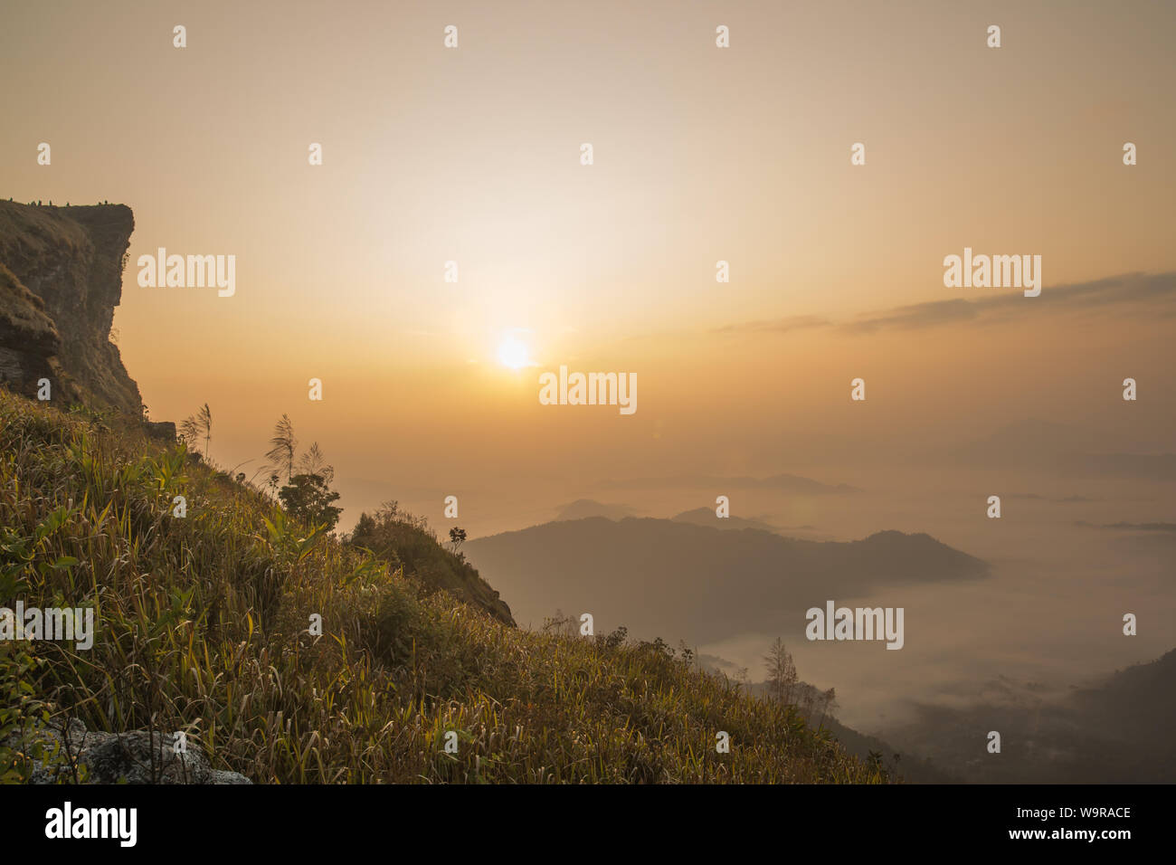 Sunrise scene with the peak of mountain and cloudscape at Phu chi fa in Chiangrai,Thailand Stock Photo