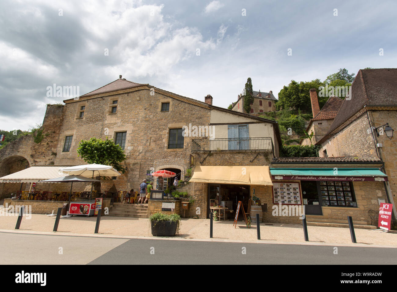 Village of Limeuil, France. Picturesque view of riverfront shops and