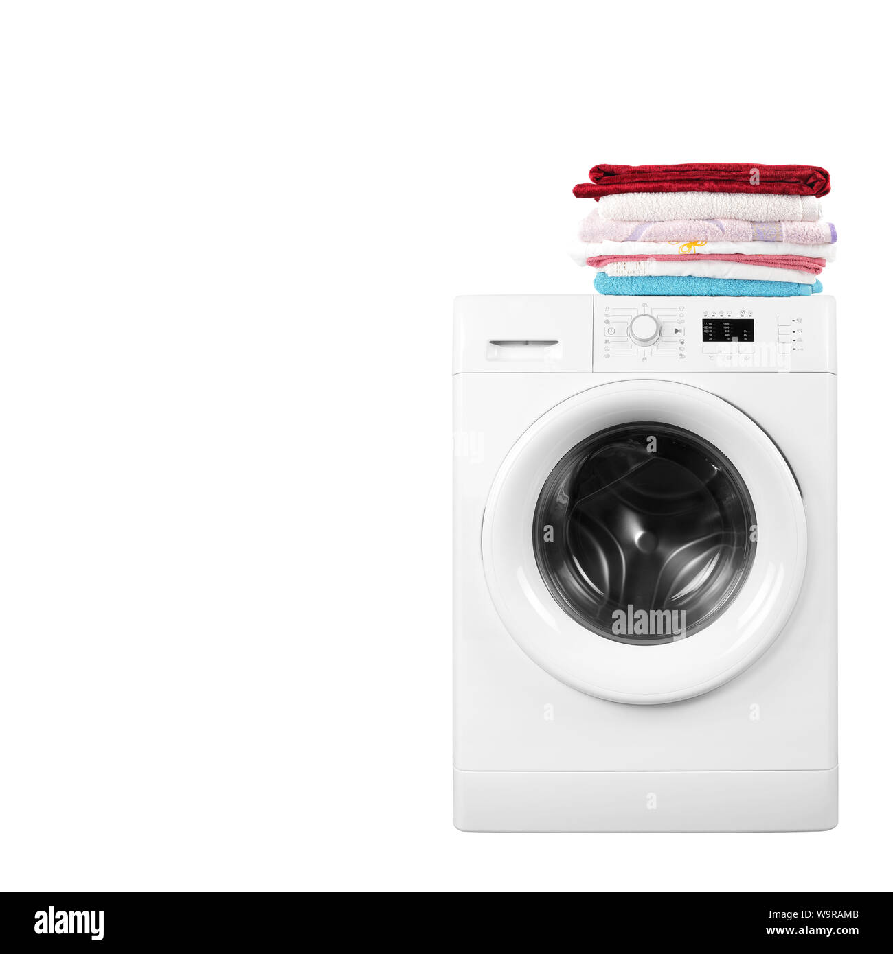 Major appliance - Front view washing machine and linen pile on a white background Stock Photo
