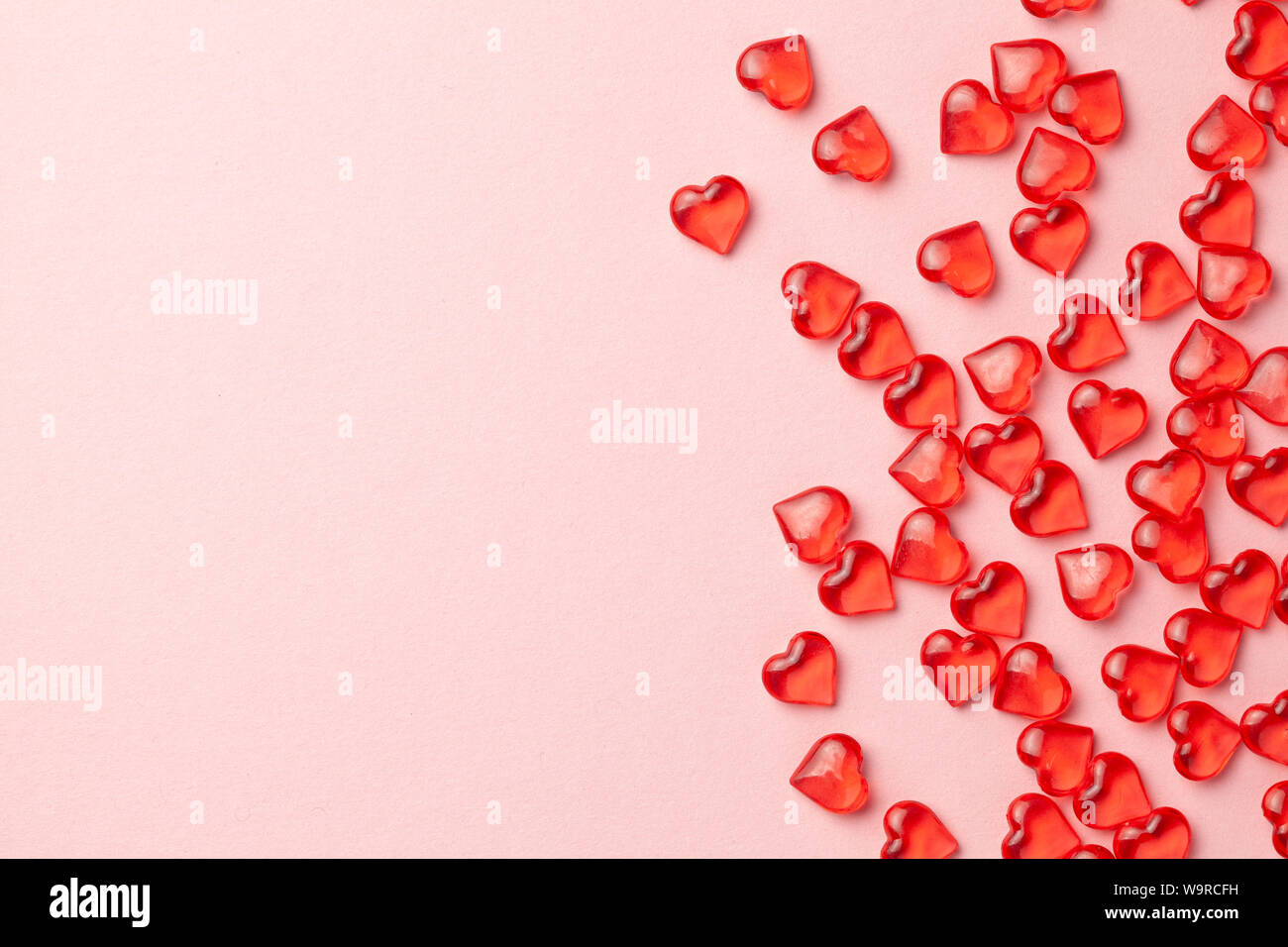 Red hearts on a pink background as frame. Empty place for copy space ...