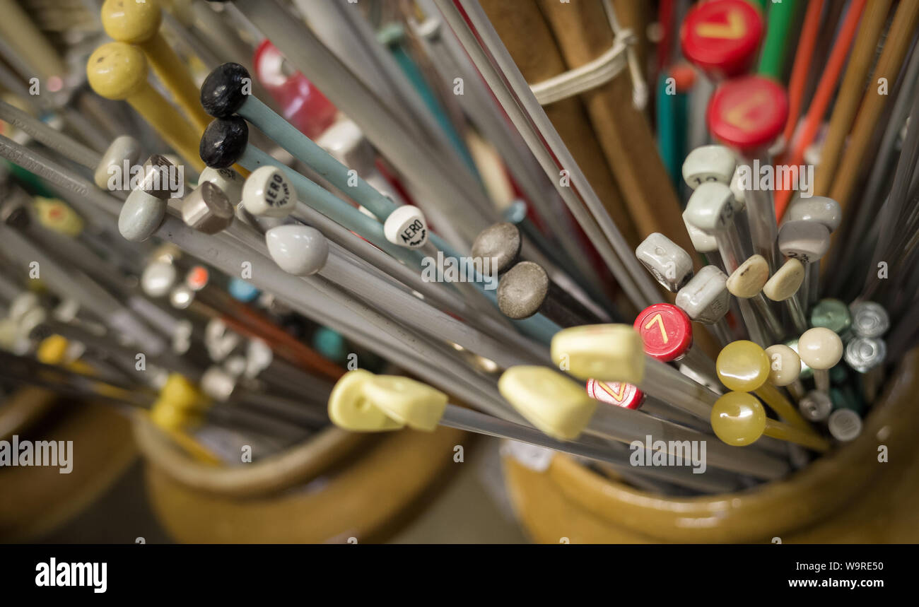 A selection of old knitting needles for sale in secondhand shop Stock Photo  - Alamy