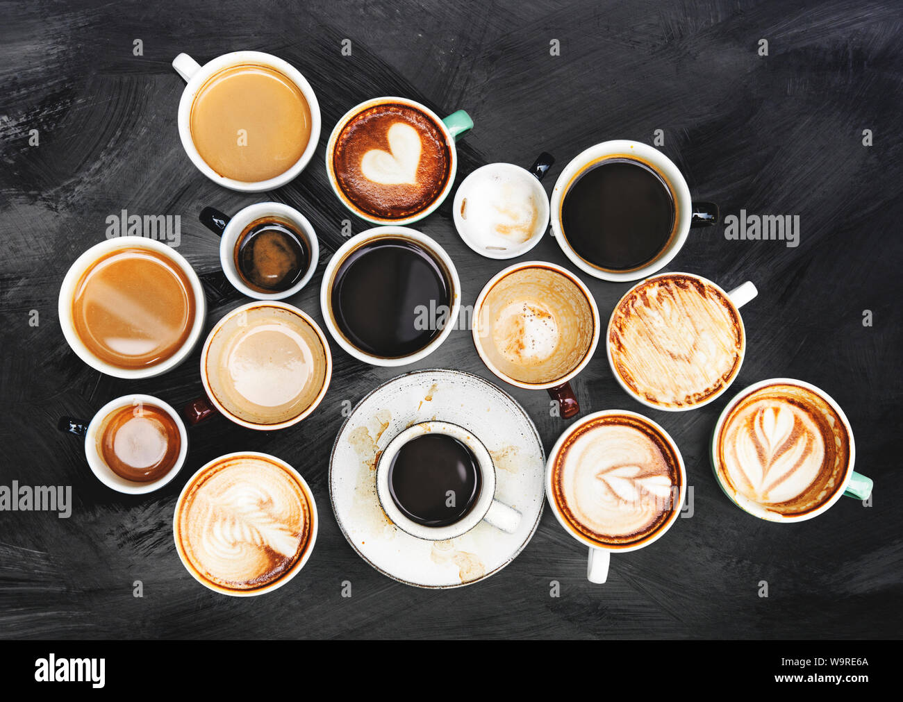 Assorted coffee cups on a textured background Stock Photo - Alamy