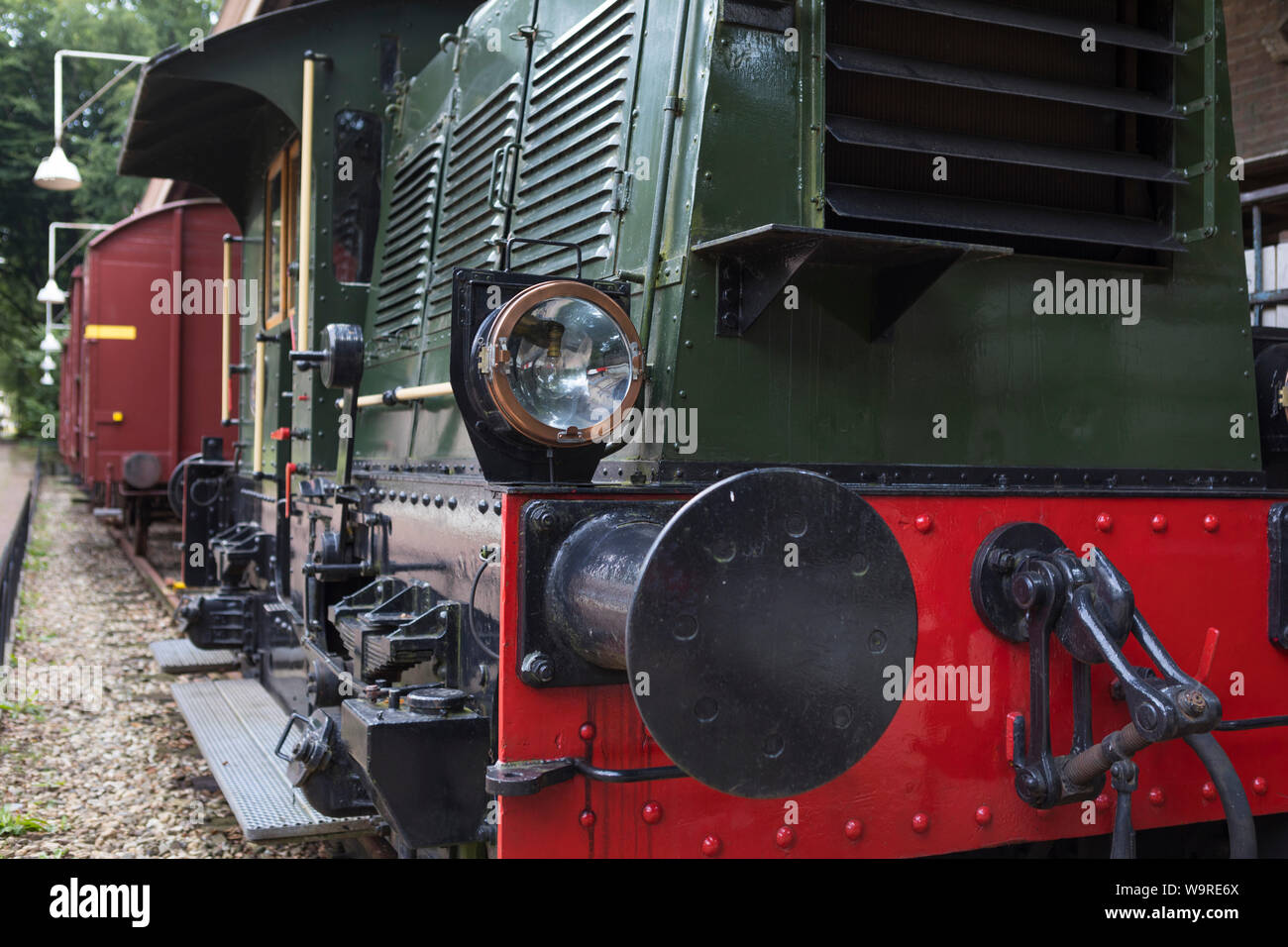 Historical diesel locomotive with freight wagons behind at open air museum Arnhem, Netherlands Stock Photo