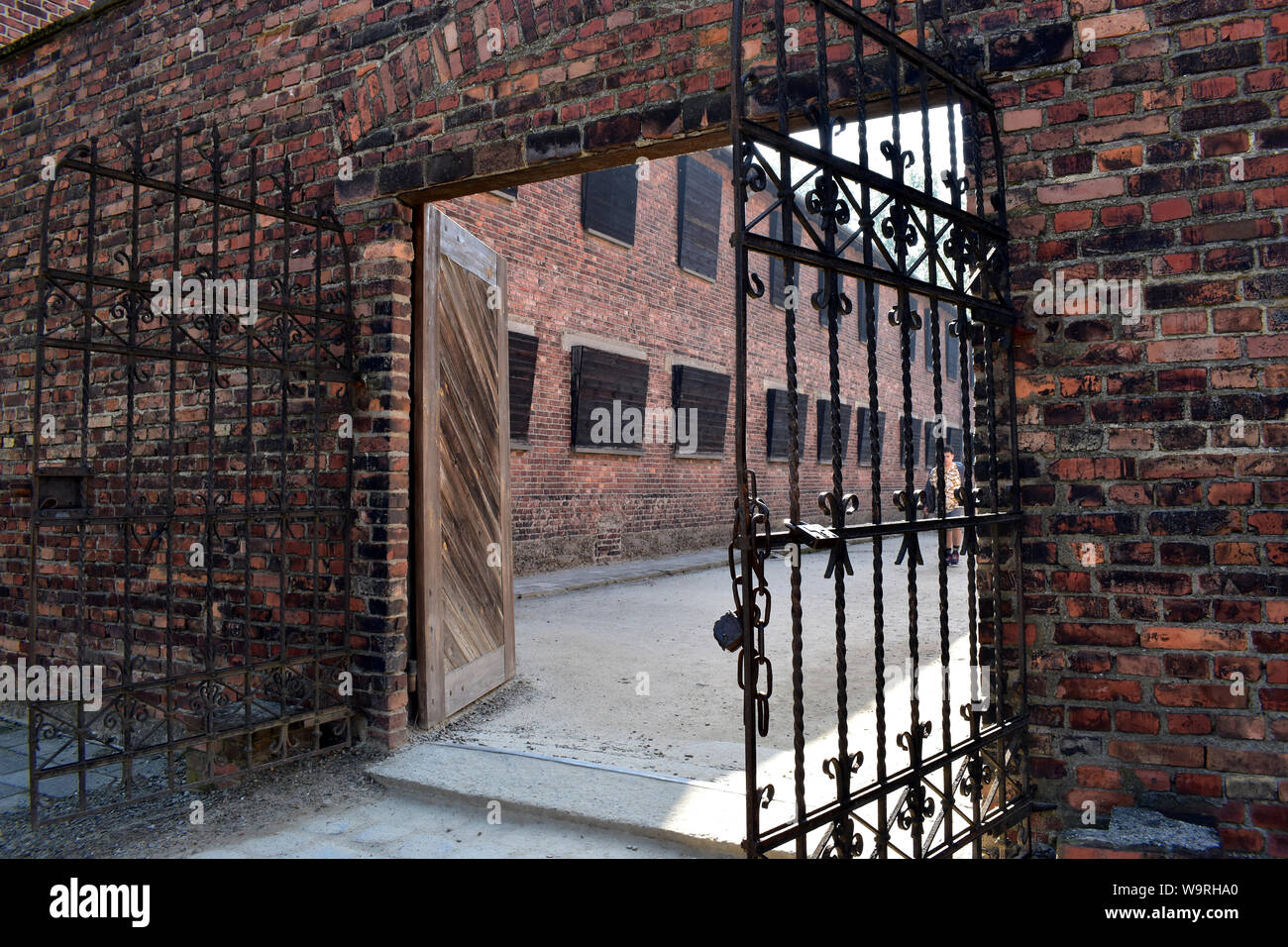 A view of female quarters through security gates at the Concentration Camp  in Poland Stock Photo