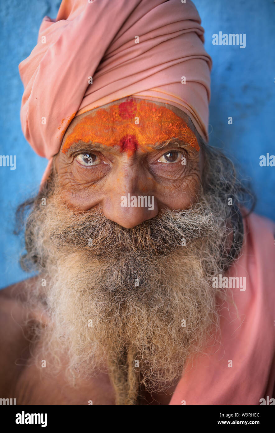 Sadhu (holy man) on the ghats of Ganges in Varanasi, India. Varanasi is the holiest of the seven sacred cities in India. Stock Photo