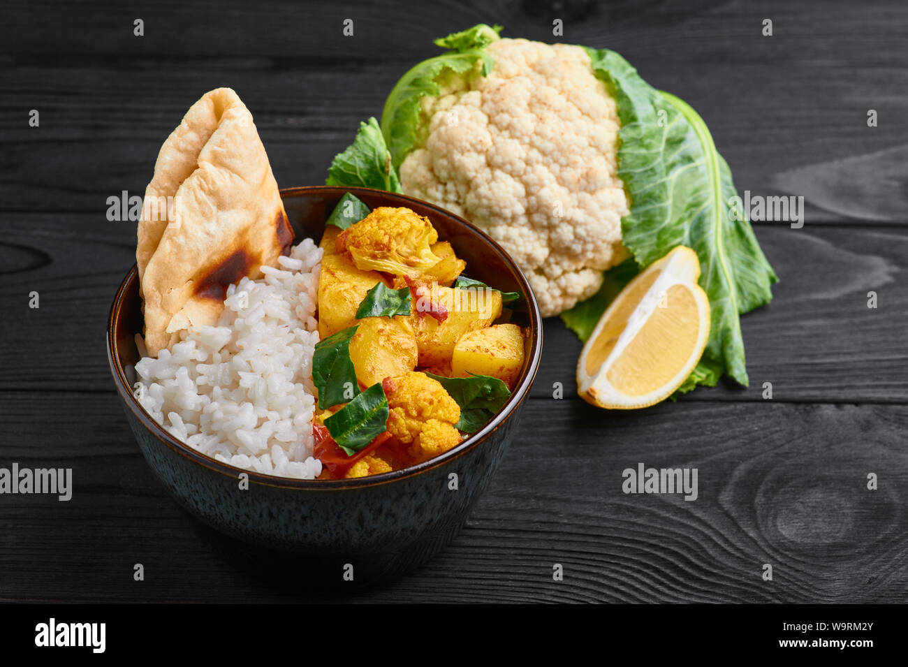 aloo gobi with rice and chapati. Indian cuisine vegetarian curry cooked