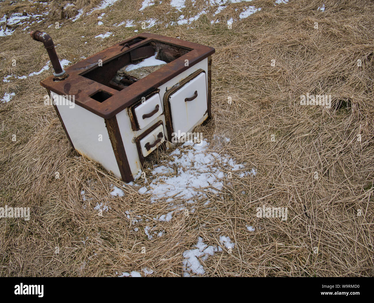 An antique kitchen stove outside on a meadow. Photo from April in Iceland Stock Photo