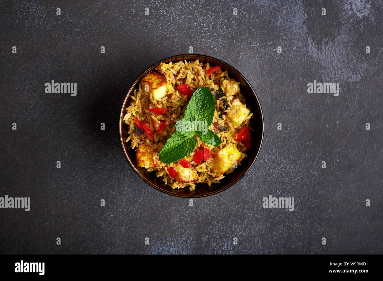 vegetarian paneer biryani at black background. paneer biryani is
