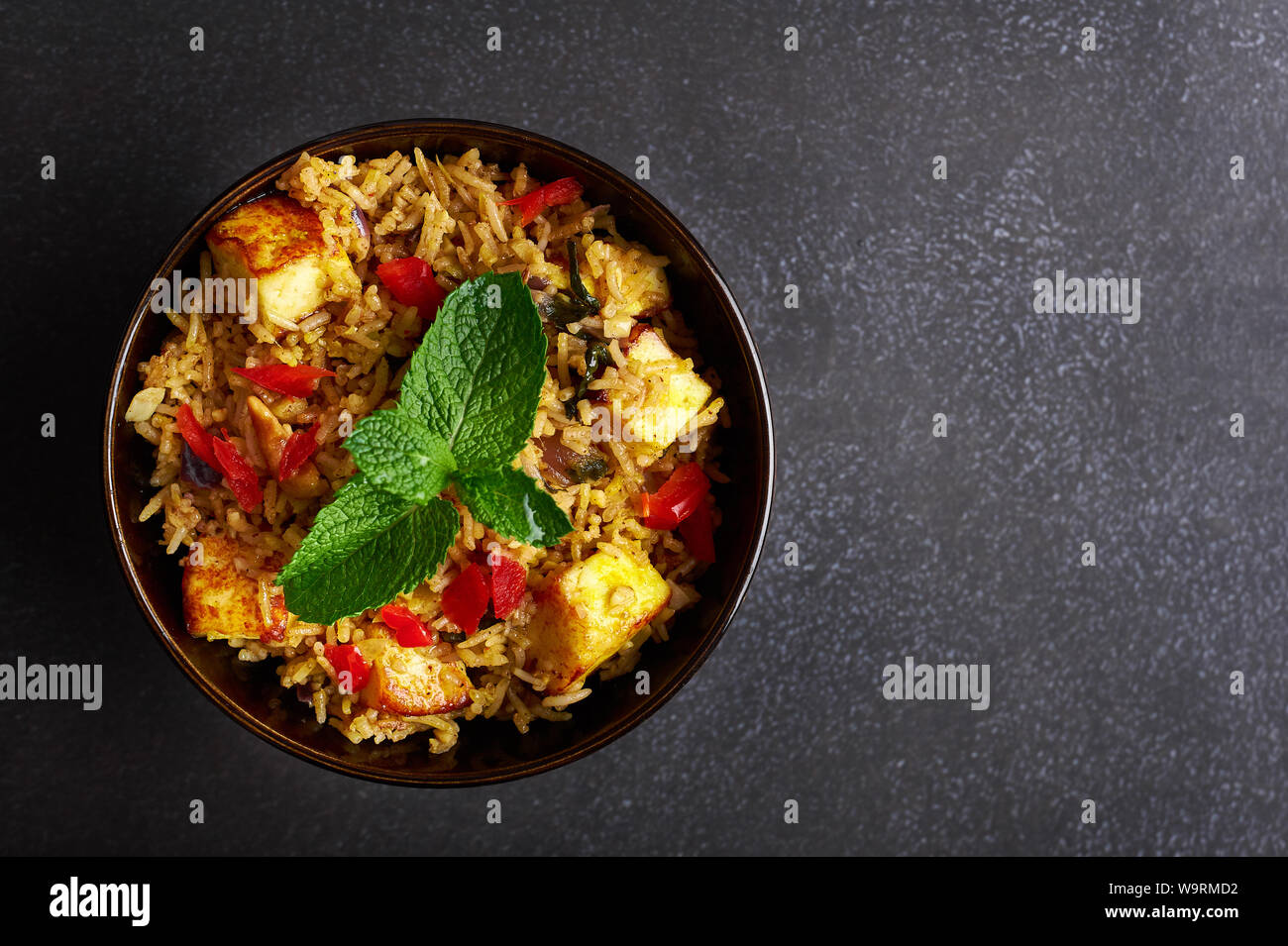 vegetarian paneer biryani at black background. paneer biryani is