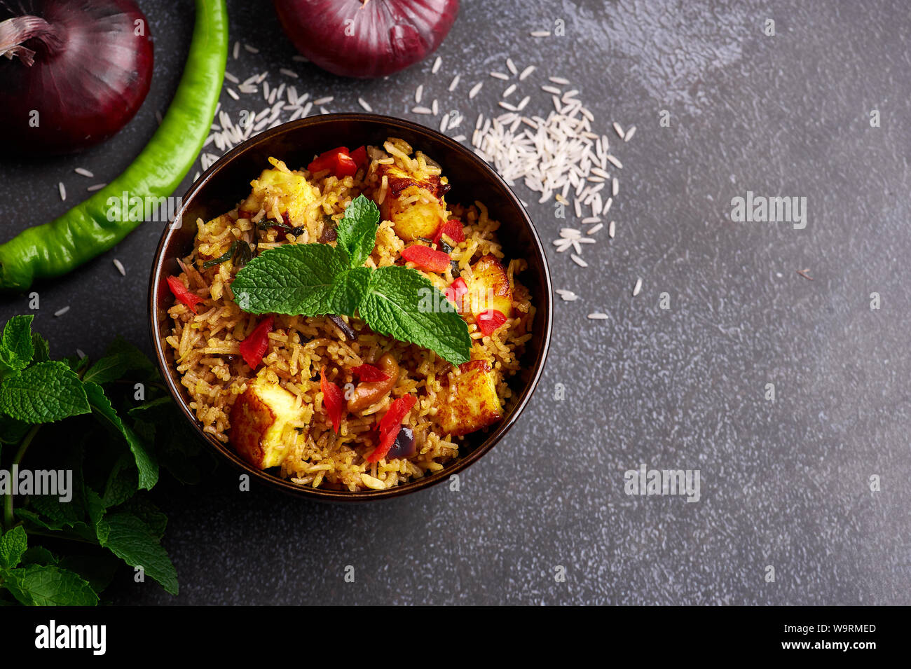 vegetarian paneer biryani at black background. paneer biryani is