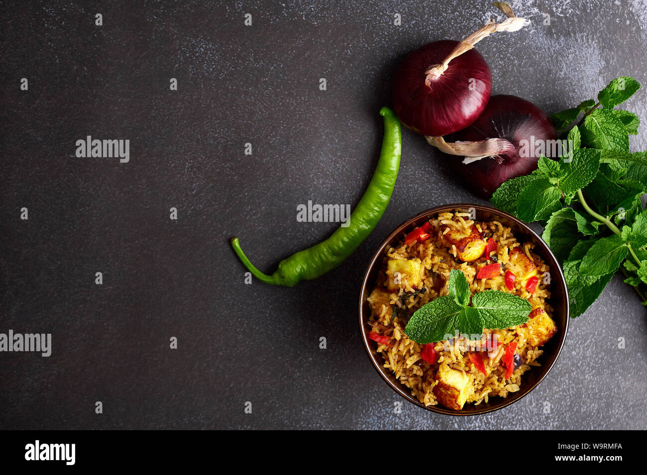 vegetarian paneer biryani at black background. paneer biryani is