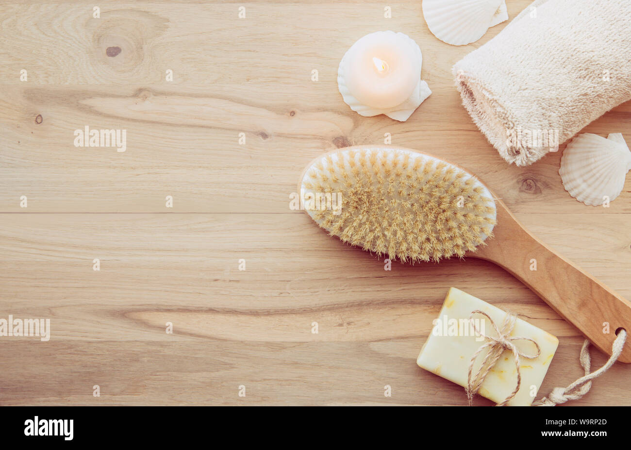 Dry brushing the skin in a pattern with a dry brush, usually before showering help reduce cellulite and remove toxins in human body. Selective focus o Stock Photo