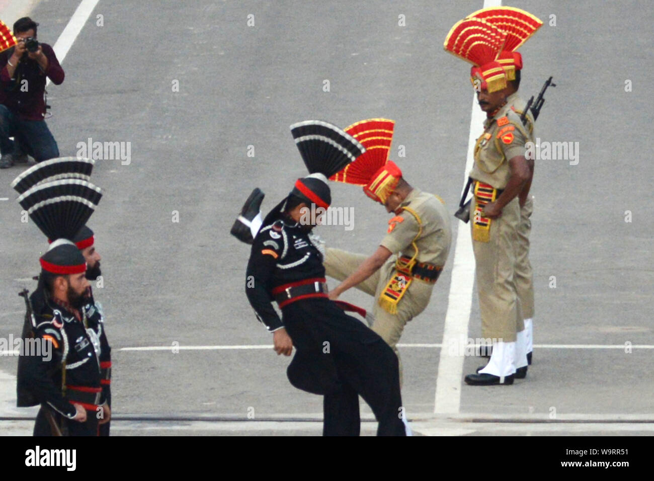 Rangers and soldiers in black uniform face (R) and an India Border ...