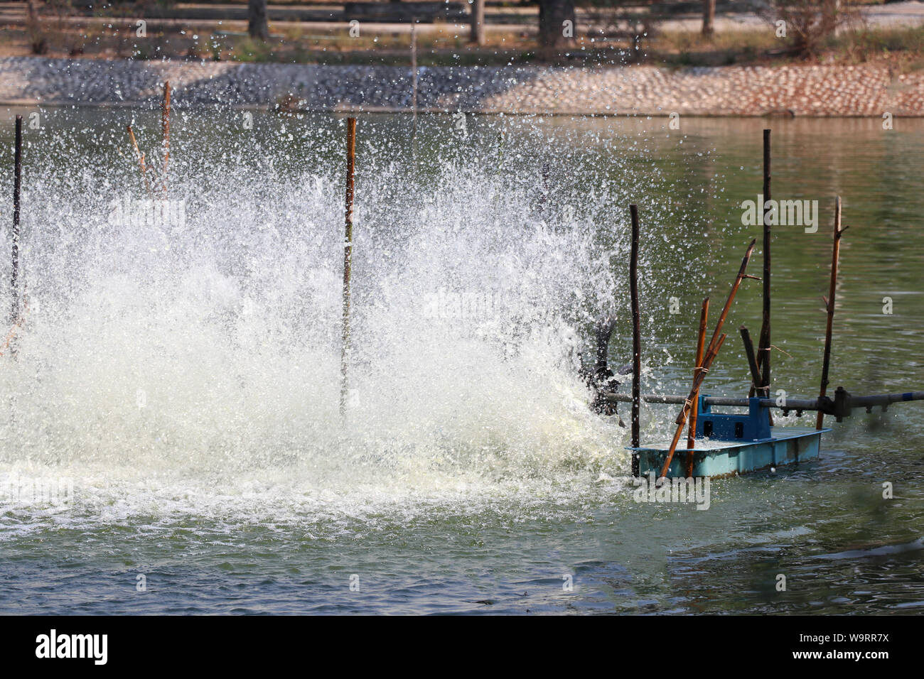 Oxygen generator is hitting the surface to create the bubbles for wastewater treatment. Stock Photo