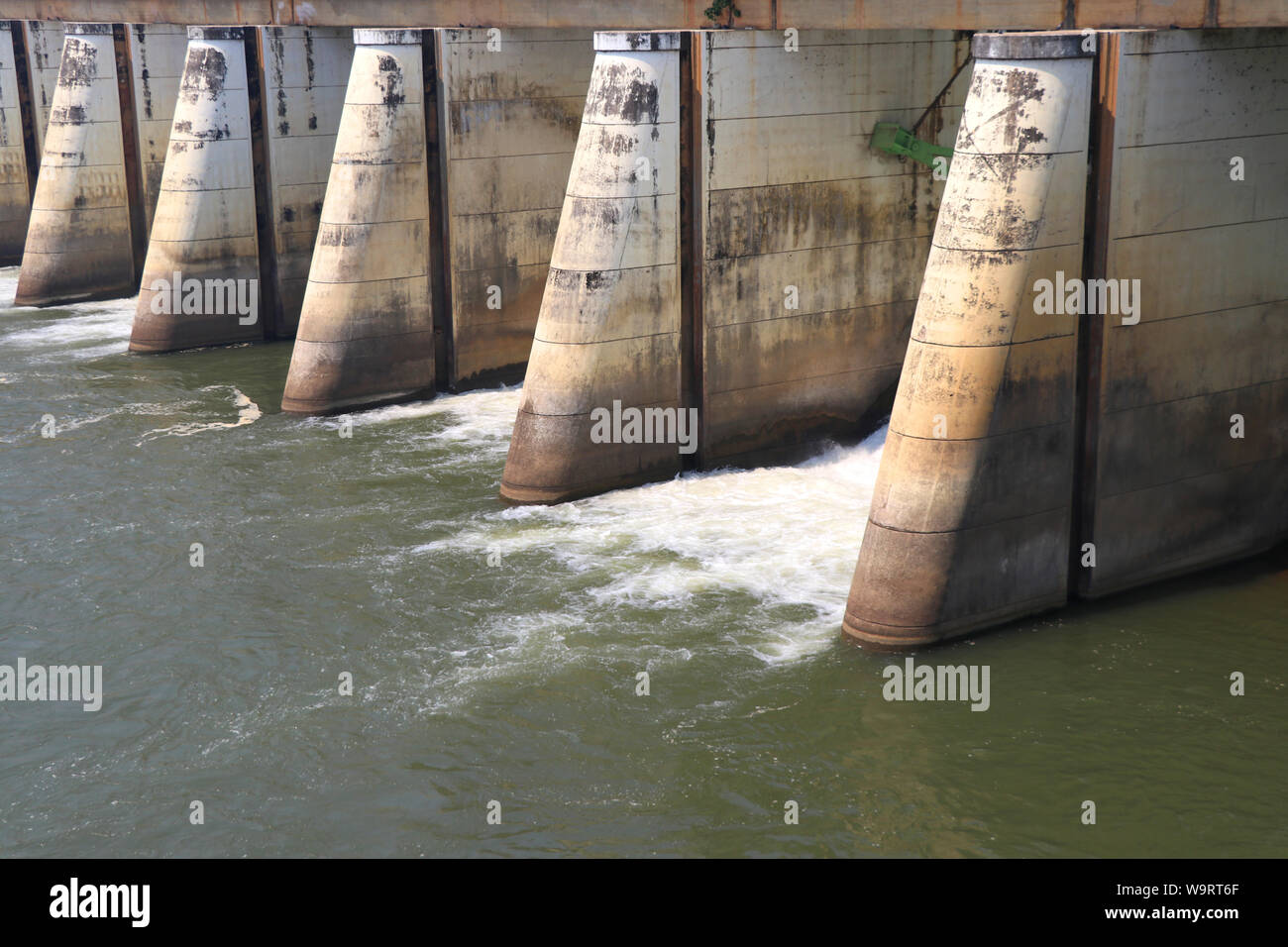 Dams are released for agriculture. Watergate and discharge. Dam for controlling water management. Stock Photo
