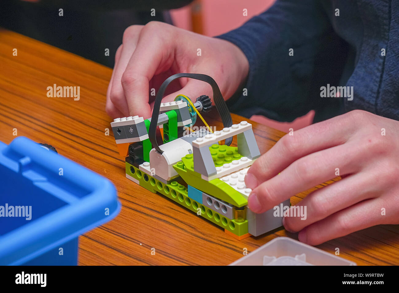 The boy makes a car model from the details of children's designer Stock Photo