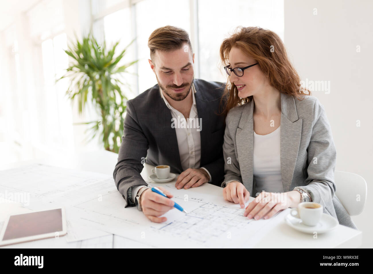 Two young architects working together in office Stock Photo