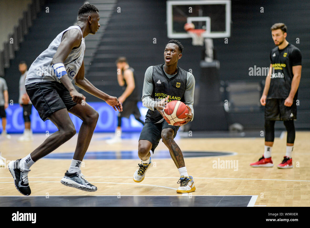 Hamburg, Germany. 15th Aug, 2019. Germany's Isaac Bonga (l) and Germany's  Dennis Schröder fight for the