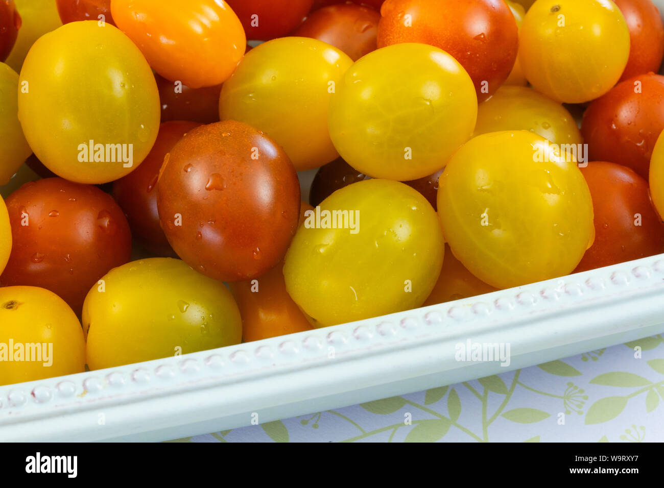 several yellow and red cherry tomatoes Stock Photo