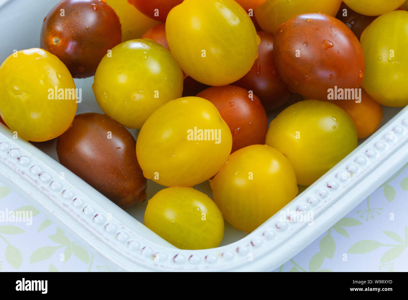 several yellow and red cherry tomatoes Stock Photo