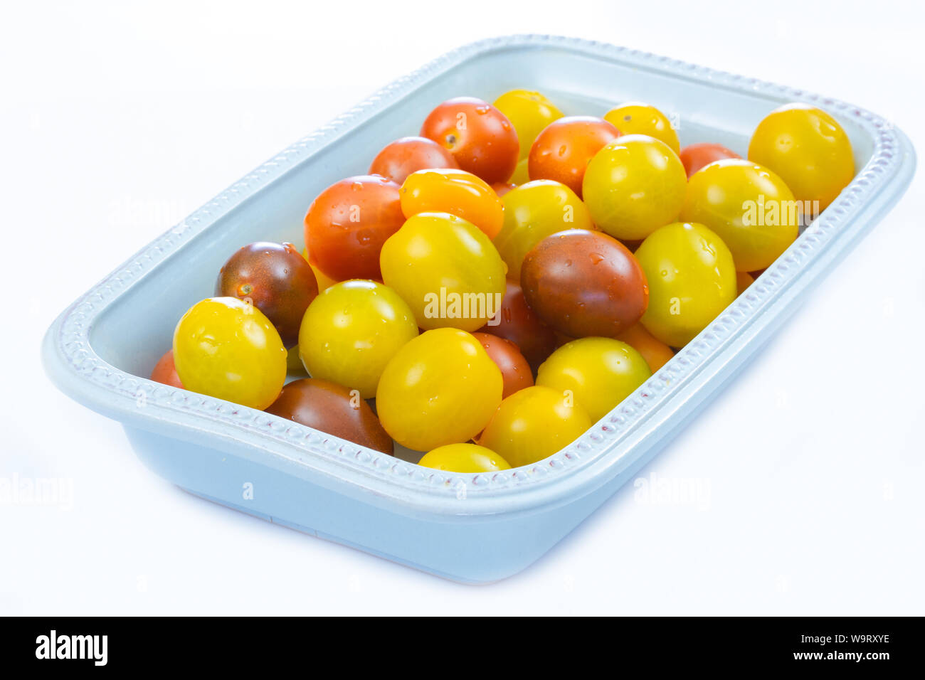 several yellow and red cherry tomatoes Stock Photo