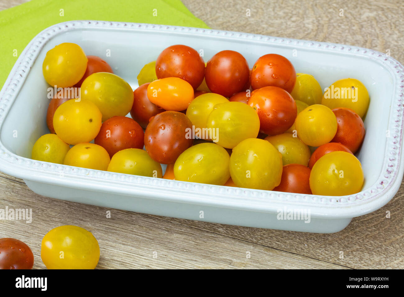 several yellow and red cherry tomatoes Stock Photo