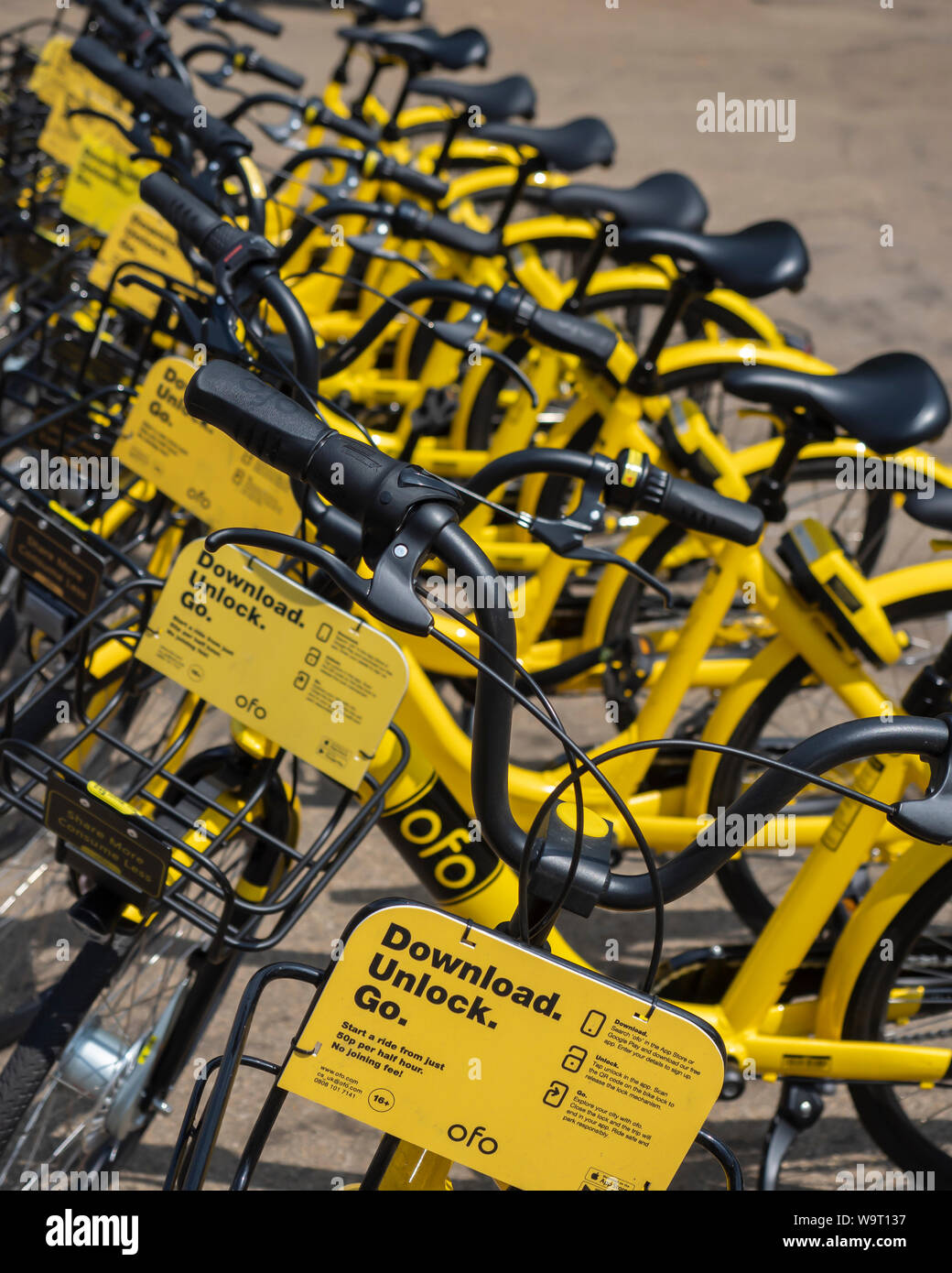 LONDON, UK - JULY 26, 2018:  Ofo dock-less bikes at a hire station Stock Photo