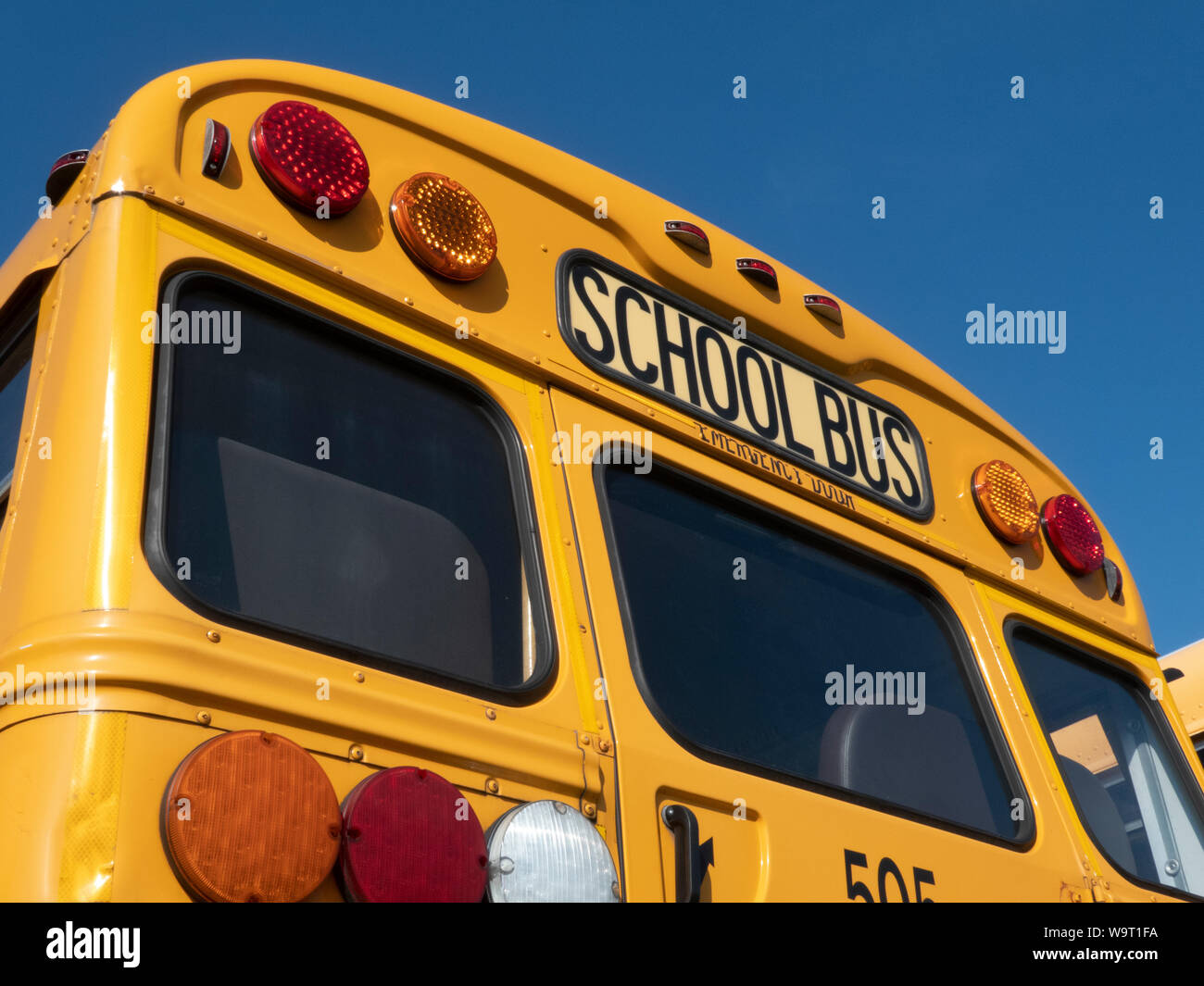 School buses parked on lot. Stock Photo