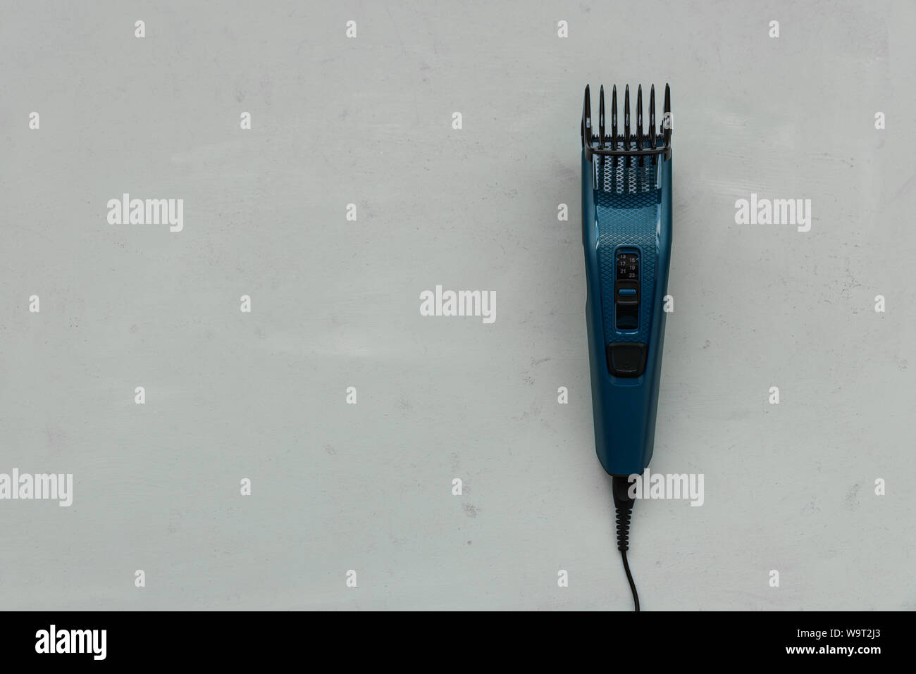 Electric Hair Trimmer On Gray Wooden Background Copy Space Top