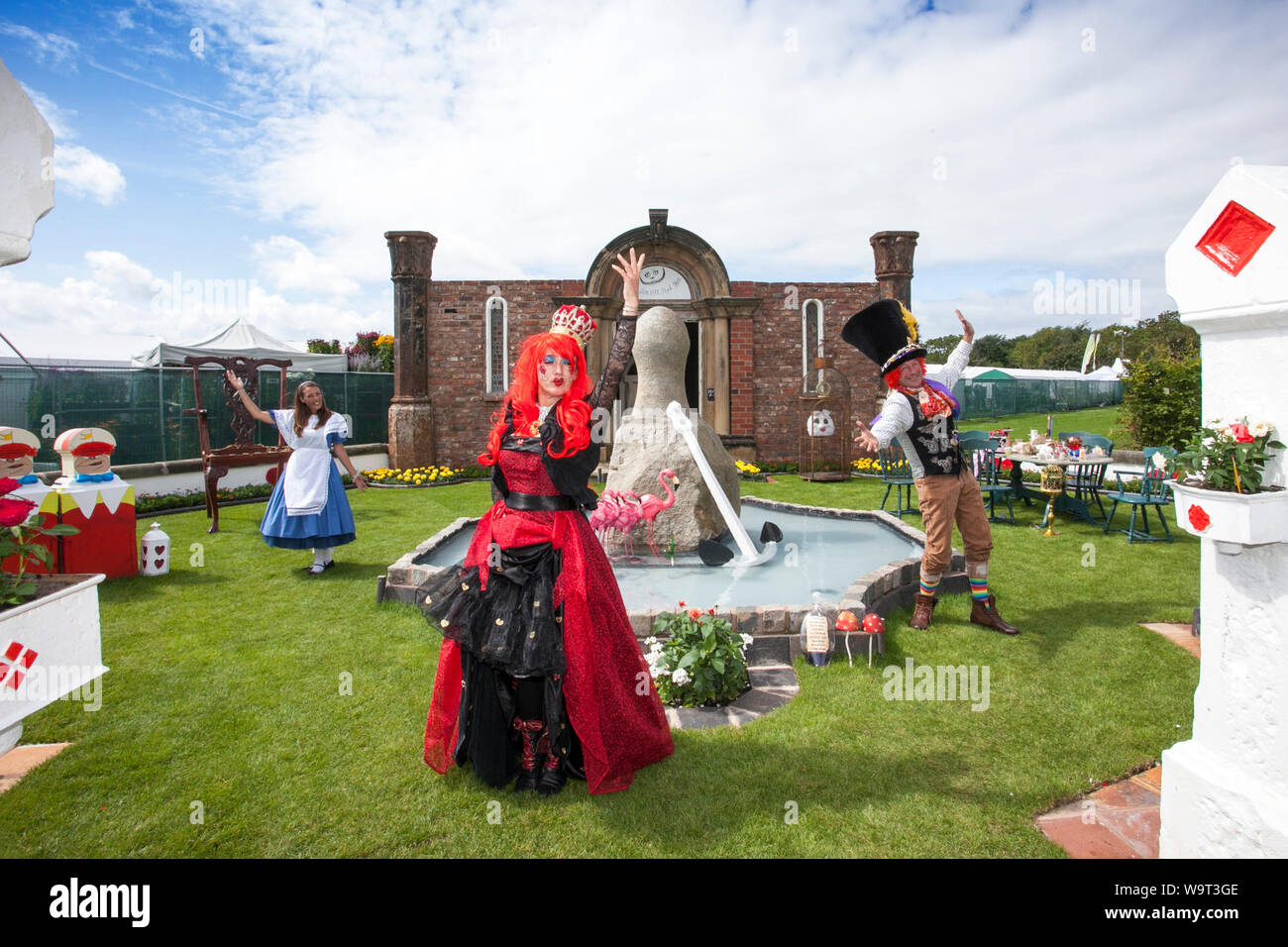 Southport, Merseyside, 15th August 2019.  Let the craziness begin as the Mad Hatters bring chaos and fun to the Flower Show in Southport, Merseyside.  The costumed performers welcomed visitors to the seaside event as it celebrates its 90th anniversary this week with a giant tea party.  Credit: Cernan Elias/Alamy Live News Stock Photo