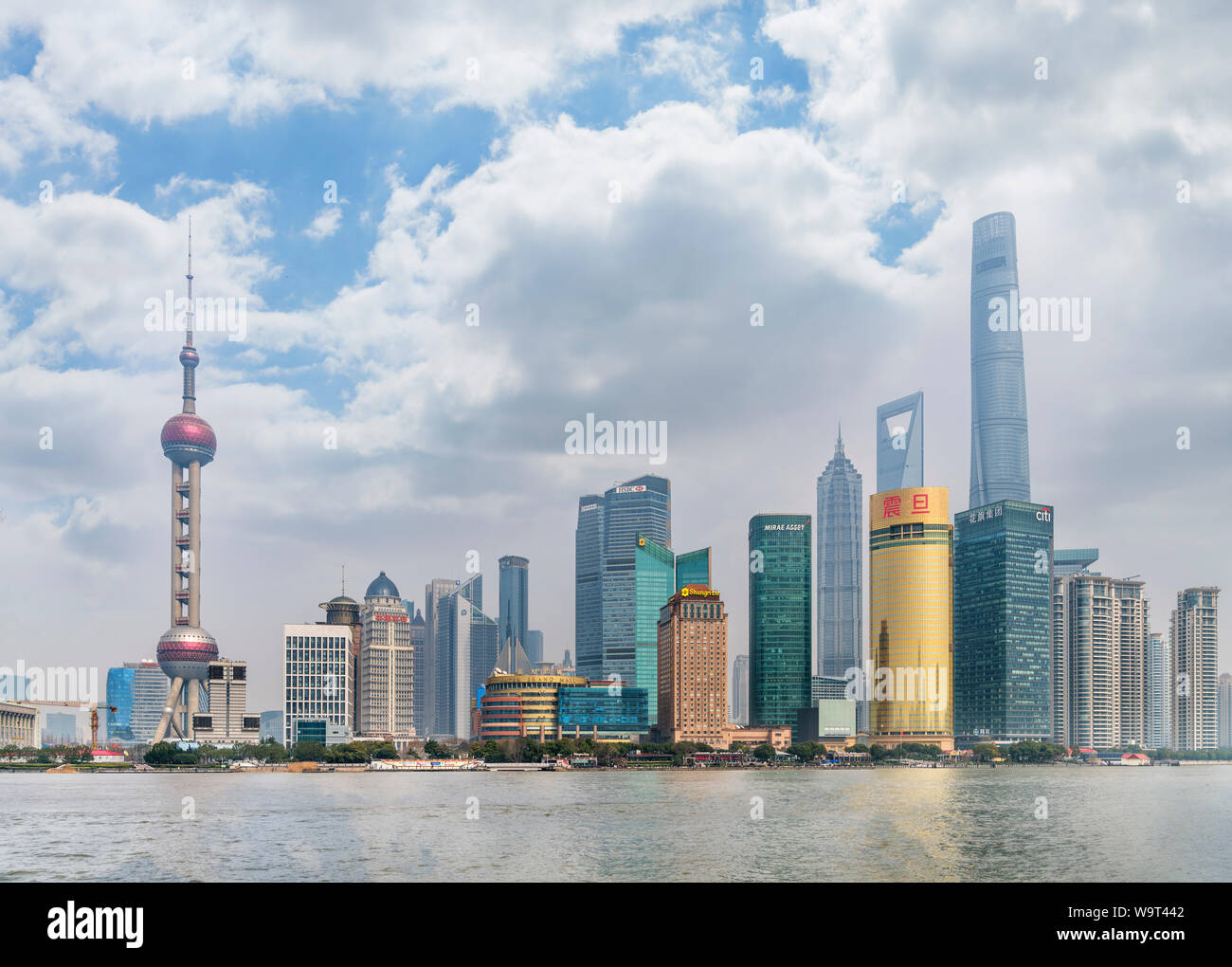 Business district of Pudong and Huangpu River viewed from The Bund with Oriental Pearl Tower to left and Shanghai Tower to right, Shanghai, China Stock Photo