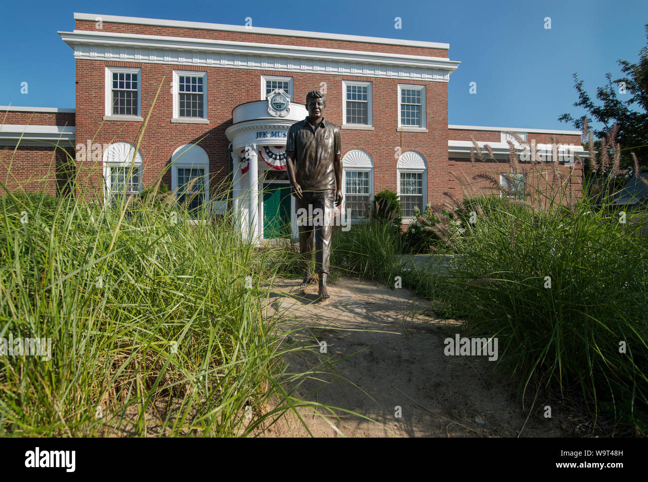 Life-sized bronze statue of John F. Kennedy (JFK) by sculptor David Lewis in front of the JFK Museum in Hyannis, Massachusetts. Stock Photo