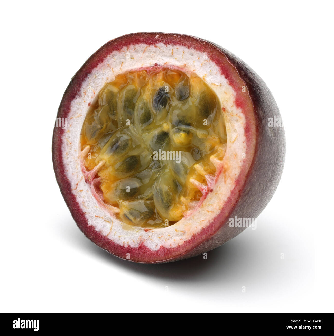 Single half passion fruit isolated on white background Stock Photo