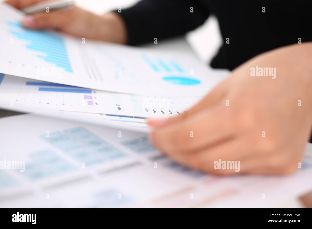 businesswoman study documents in office closeup Stock Photo - Alamy