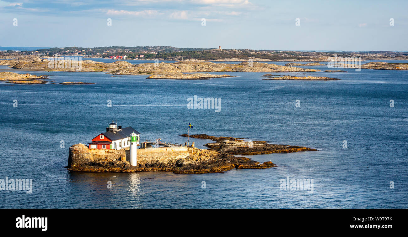 Small rocky outcrop with lighthouse, beacon in the Kattegat sea off the coast of Gothenburg, Sweden on 26 July 2019 Stock Photo