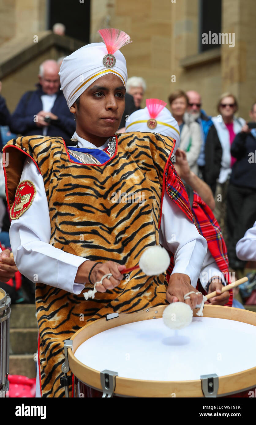 Glasgow, UK. 15 August 2019.  Piping Live, thought to be the biggest celebration of bagpipe music and pipe bands continues to attract large audiences and entertain with free performances in Buchanan Street in Glasgow's City Centre from international pipe bands. Sri Dasmesh Pipe band from Malaysia entertain. Credit: Findlay/Alamy Live News Stock Photo