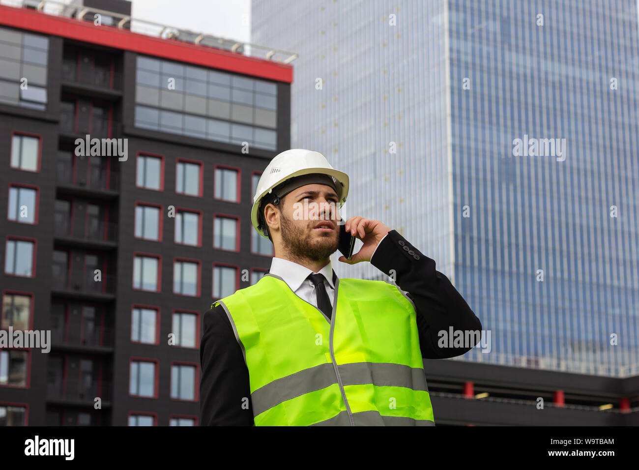 builder engineer talking on the phone businessman serious worker Stock Photo
