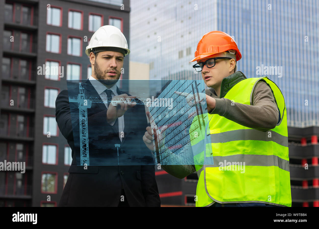 engineer and builder hologram discuss drawing new technologies virtual  business Stock Photo