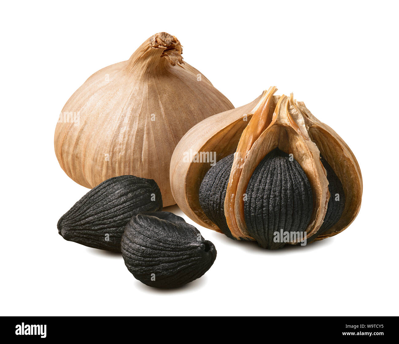 Black garlic bulbs and cloves isolated on white background. Package design element with clipping path Stock Photo