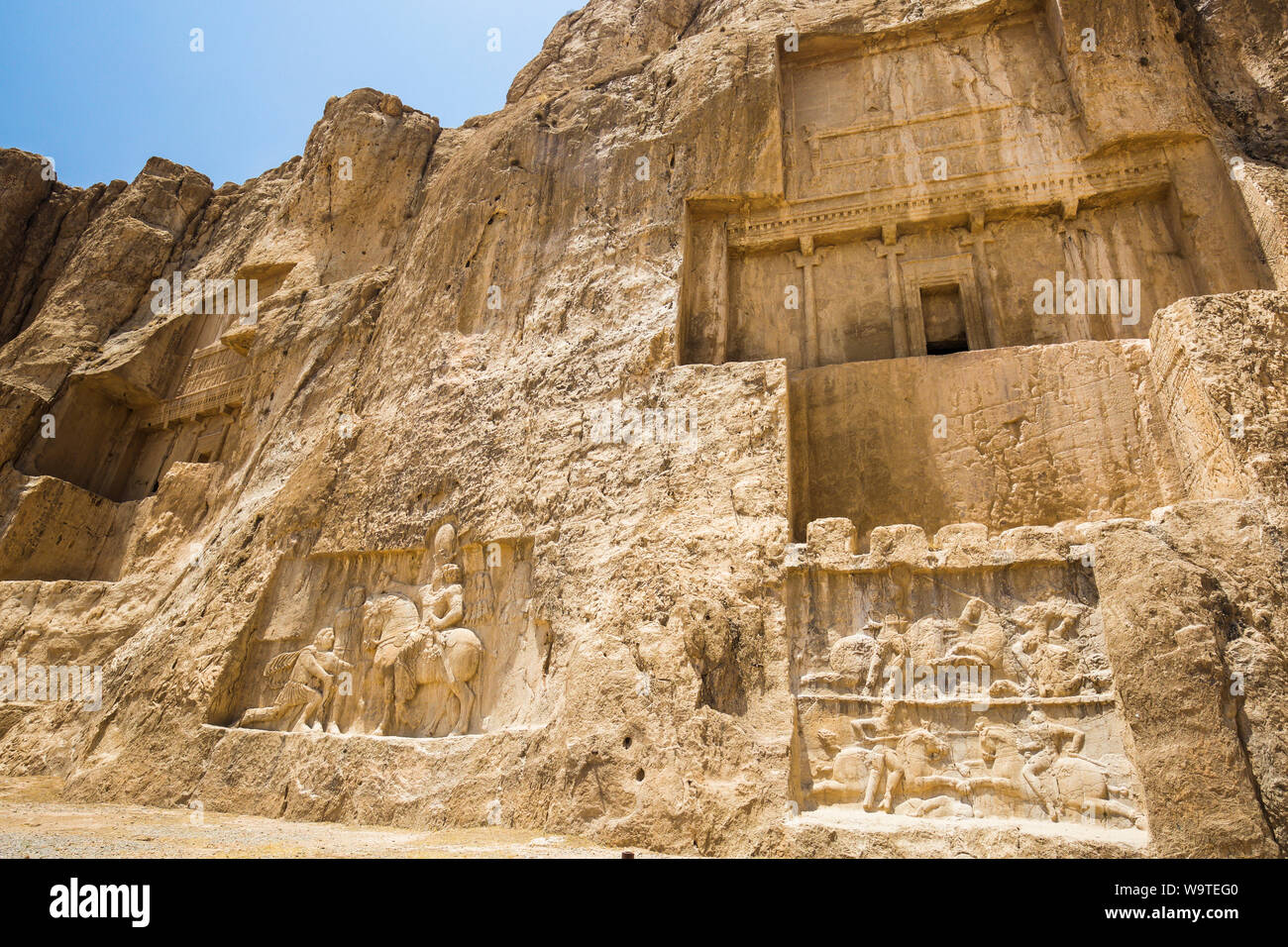Reliefes and Darius I tomb. Stock Photo