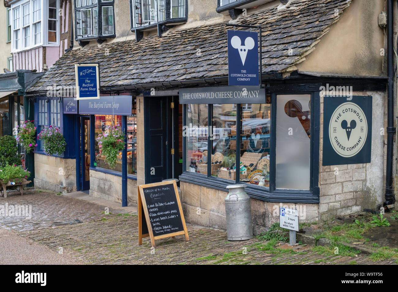 The Cotswold cheese company and the Burford farm shop in the high street. Burford, Cotswolds, Oxfordshire, England Stock Photo