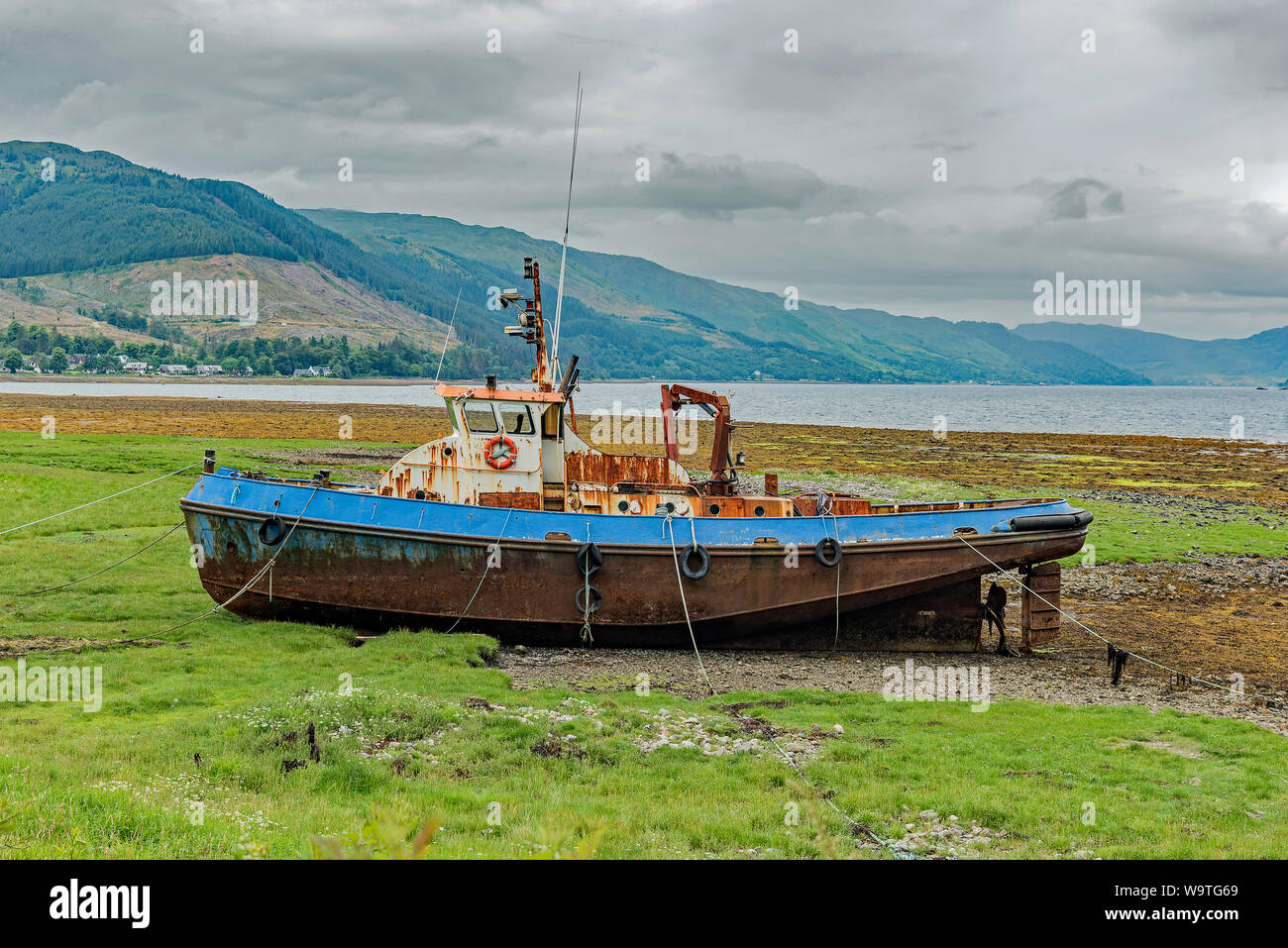 Tugboat on the shores of Loch Duich, Scotland - views Stock Photo